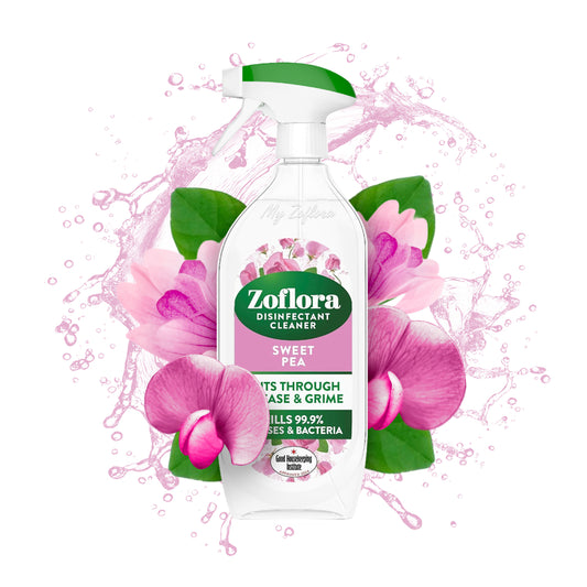 Zoflora disinfectant cleaner bottle with pink flowers and green leaves on a white background